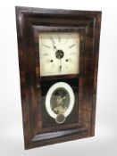 A late 19th century continental wall clock, length 65 cm.