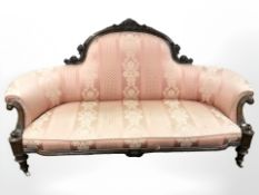 A late Victorian carved walnut three piece lounge suite : three seater settee (187 cm x 80 cm x 102