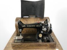 An antique Singer hand sewing machine.