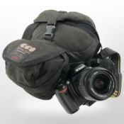 A Nikon D40X digital camera with Nikon AF-S Nikkor 18-55mm 1:3.5-5.6 lens, with carry bag.