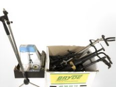 A quantity of folding guitar stands, a Stagg violin stand in box, guitar strings, etc.