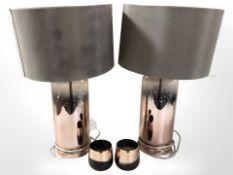 A pair of contemporary copper effect glass table lamps and two matching tea light holders,