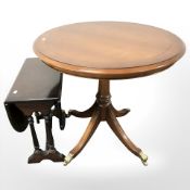 A reproduction yew wood occasional table and a mahogany drop leaf table