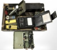 A vintage torch, battery pack, tins, tools, etc.