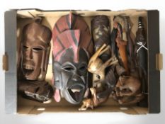 A group of carved hardwood tribal masks and animal figures (one box)