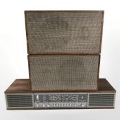 A Bang & Olufsen Beomaster 900, together with a pair of speakers.