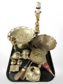 A brass lamp base, pedestal dishes, candlesticks, bellows, etc.