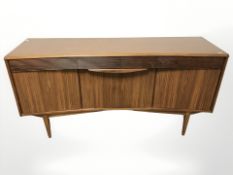 A teak inverted bow front sideboard, fitted cupboards and drawers, 151 cm x 45 cm x 76 cm.