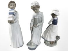 Three Nao figures, No. 231, 233 and 397, all boxed.