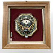 A Chinese relief panel depicting a dragon, 36 cm x 36 cm.