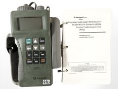 A Rockwell GPS receiver with instruction manual.