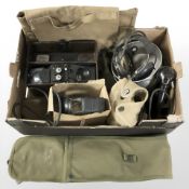 A group of militaria including a field telephone in Bakelite case,