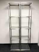 A pair of metal glass open display shelves,