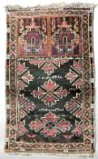 An Afghan geometric rug,