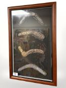 A collage of four miniature aboriginal boomerangs, 33 cm x 49 cm.