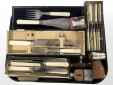 Several cases of cutlery, miniature hip flask, set of drinking tots, corkscrew, etc.