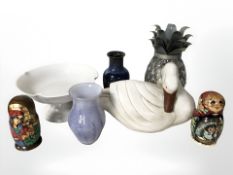 A group of ceramic and glass vases, two Russian dolls, wooden swan ornament, etc.