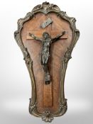 A bronze and rosewood crucifix, circa 1900, indistinctly signed, length 49cm.