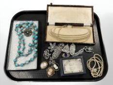 A group of costume jewellery, cameo brooches, Art Deco style clip brooches, etc.