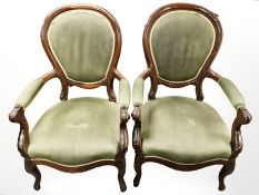 A pair of mahogany salon armchairs in green upholstery