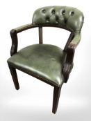 A reproduction mahogany and green buttoned leather desk armchair, width 58 cm.