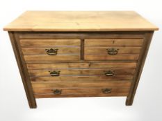 An Edwardian walnut four drawer chest, 103 cm x 47 cm x 83 cm.