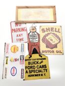 A group of enameled and wooden advertising signs including Shell, etc.