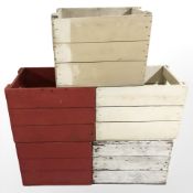 Five vintage painted pine bottle crates, width 48 cm.