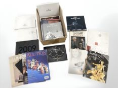 A group of vintage watch catalogues including Rolex, Cartier, Vacheron Constantin, Omega, Longines,