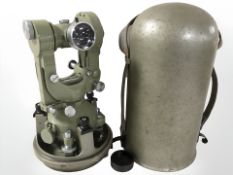 A Wild Heerbrugg of Switzerland theodolite T2-109786, with domed protective cover, height 33 cm.