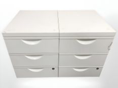 A pair of enamelled metal three drawer filing chests,