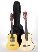 Two Music Alley classical guitars, with one soft carry bag.