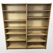 Two 20th century oak veneered open bookcases with adjustable shelves, 90 cm x 28 cm x 200 cm.