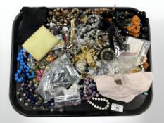 A group of costume jewellery, beads, butterfly pendant,