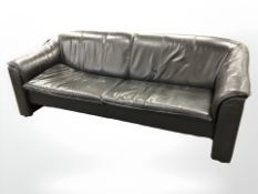 A late 20th century Danish three piece black leather lounge suite comprising of three seater settee,