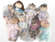 A group of Cabbage Patch kids dolls.