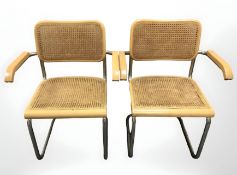 A pair of cane cantilever armchairs.