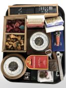 A group of stained wooden chess pieces, dominoes, playing cards, cigar cutter, bottle openers,