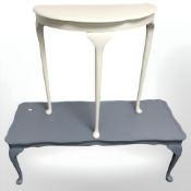 A painted shaped top coffee table on pad feet, length 130 cm,
