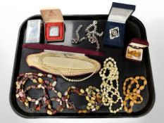 A group of costume jewellery including beaded necklaces, Ronson lighter,