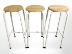 Three metal and pine bar stools, height 77 cm.