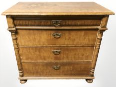 A 19th century continental stained beech four drawer chest on bun feet,