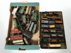 A quantity of plastic and tin plate rolling stock.