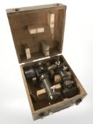 An R Poulin French military telescopic sight, in pine storage box, width 24 cm.