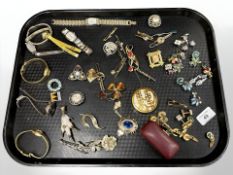 A group of costume jewellery including wristwatches, brooches, cufflinks, etc.