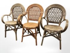 A par of wicker armchairs and one other