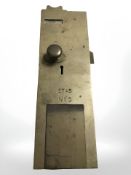 A 19th century brass toilet door lock plate, length 35 cm.