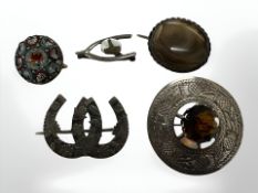 A group of antique brooches to include silver kilt pin, horseshoe brooch, etc.
