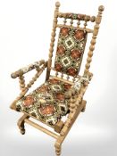 An oak bobbin turned rocking chair