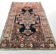 A Hamadan rug, North-West Iran, 264 cm x 170 cm.